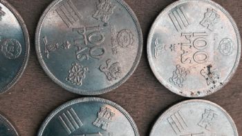 Descubre el tesoro europeo: Moneda de 100 Pesetas que te abre las puertas a un tour nocturno por la Alhambra